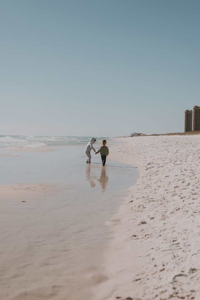 documenting simple moments like brothers walking down the beach together